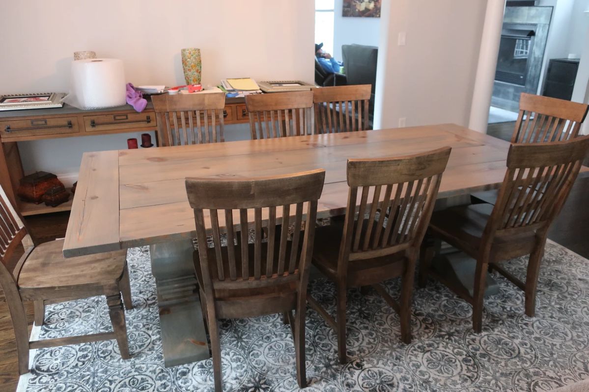$1795.00 Custom made oak dinning room table and chairs stained to match. The table is 96" x 45". (there are no pads or leaves)