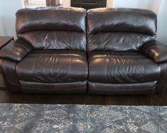 $700.00 Leather sofa It is 92" wide and 44" deep. They are power and leg lifts up.