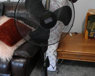 Black and decker floor fan. Baby mattress in background