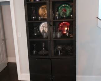 $300.00 Restoration hardware black metal china cabinet. It is 38" wide x 91" tall x 19" deep. There is storage underneath.