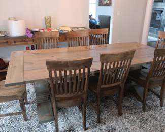 $1795.00 Custom made oak dinning room table and chairs stained to match. The table is 96" x 45". (there are no pads or leaves)