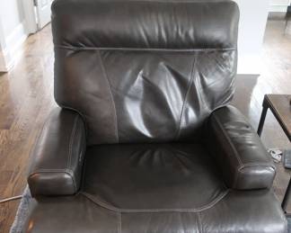 Leather chair- It is 38"wide x 39" deep. There are two. it has power lift legs.