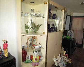 Display cabinet with statues, crystal and glass