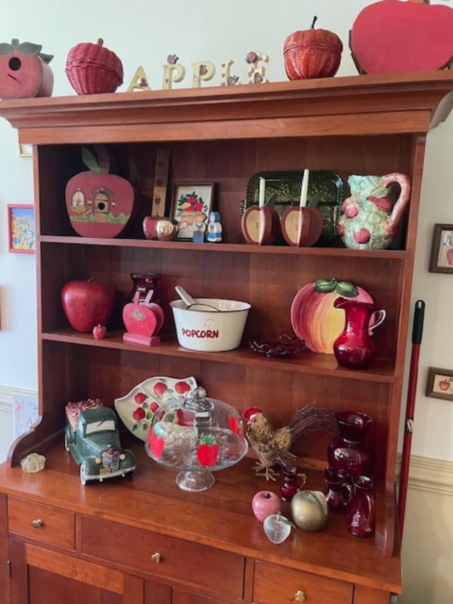 Cupboard loaded with apple items