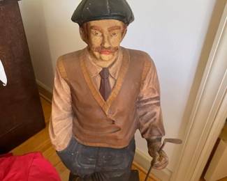 Lots of golf collectibles! This is a great carving