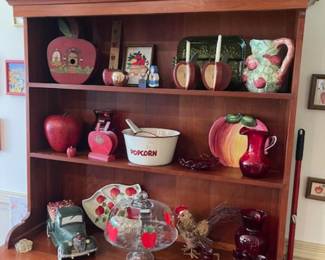 Cupboard loaded with apple items