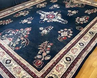 One of four 9' by 12' area rugs