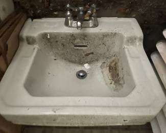 A vintage sink with original hardware