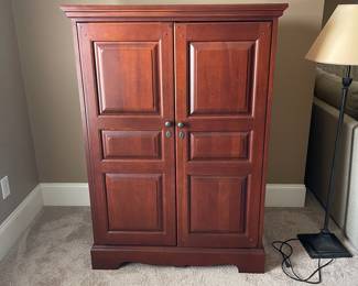 K33 - $60. Small Armoire. Measures 35.5" wide x 21" deep x 54.5" tall.
