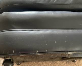 K38 - $65 - Blue Leather Chair w/ Ottoman. Measures 35w x 34d x 30t