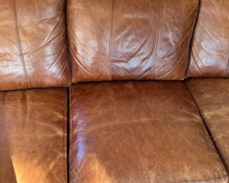 K43 - $1200 - Bradington Young Leather Sofa. Cognac Brown cushions that could use a good conditioning. See photos. No rips, holes etc. Lots of life left!!! Measures 90"w x 35"d x 34"t