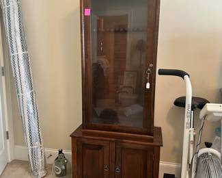 K67 - $200. Locking Gun Cabinet. It is LOCKED and we do not have a key. Measures 32"W x 16"D x 73"T