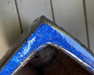 K130 - $20. Ceramic planter with sparkling blue glaze. Has a repaired corner as pictured. 7.5" square interior. 14" tall.