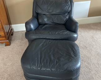 K38 - $65 - Blue Leather Chair w/ Ottoman. Measures 35w x 34d x 30t
