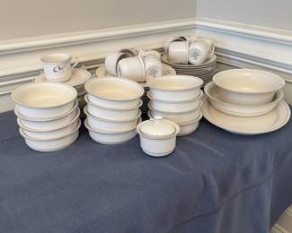 K89 - $150. Lenox Grey Brushstrokes set. Platter, 2 serving bowls, 13 dinner plates, 12 cereal bowls, 11 tea cups, 18 saucers, 14 salad plates, creamer.