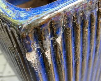 K130 - $20. Ceramic planter with sparkling blue glaze. Has a repaired corner as pictured. 7.5" square interior. 14" tall.