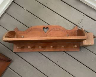 K134 - $20. Carved wood shelf with hanging pegs and attached side box. 30w11d10t.