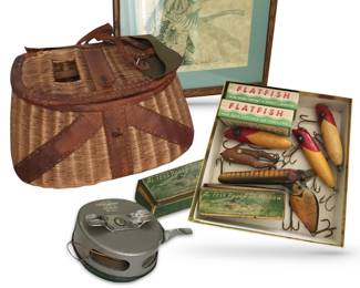 Lot/collection of vintage fishing gear includes:  wicker and leather fishing creel; Shakespeare OK No. 1821 automatic reel designed for fly fishing; one Al. Foss Pork Rind Minnow lure in tin box, with papers; two boxes of Helin Tackle Co. flatfish lures, valued for their unique swimming action; and a limited edition lithograph (44/120) entitled “Leaping Bass” by wildlife artist Randy C. Brown.  Please note: only one Al. Foss minnow lure available.  