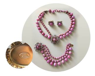 Rare c. 1950’s mauve pink Miriam Haskell complete parure —  necklace, bracelet and earrings; glass beads and roses montées in aurora borealis (AB), creating multi-colored, iridescent shimmer; signed