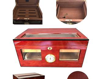 Cuban Crafters high-gloss cherry or pre-ban rosewood (?) humidor with two keys, divider/aerator tray and cedar bottom interior; approximately 7 1/8”H x 14 3/4”W x 7.8"D.  Note:  The color in the central photo of our humidor is not accurate; we don’t know why.  The LL photo is from Cuban Crafters and reflects the color more accurately.  LR: Close-up of our humidor’s top also conveying color more accurately.