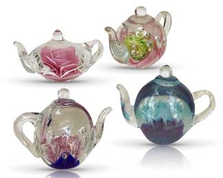 Four art glass paperweights, signed “Ruby May 2002,”each about 5”H
