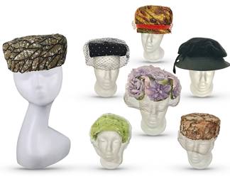 A sampling  of many vintage hats available.  Far left:  A unique 1930’s handmade sequined "feather" hat with history info included.  Remaining hats, clockwise from center top:  Original by Gertrude red-banded cloche-like hat with gold lamé threads; floppy-top black hat by Modern Miss;  netted amber feathery pillbox by Play Topper; bright green netted headband hat by Unique Made; black netted pillbox by Joel of New York and central lavender floral hat by Unique Made.  Fourteen hats available in more colors, including pinks and blues.