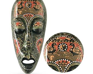 Characteristically elongated Balinese/Lombok decorative mask; high-gloss hand-painted carved wood w/mother-of-pearl inlay; features confronted birds supporting yin yang symbol recalling Balinese principle of Rwa Bhineda, the balancing of opposing forces conducing to a harmonious whole; 21”H