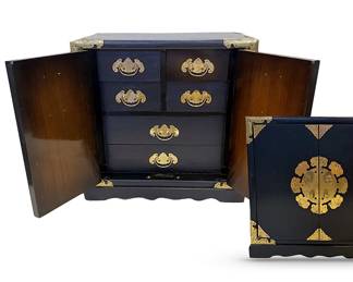 Asian lacquered jewelry box with ornate brass appliqués and silk-lined drawers