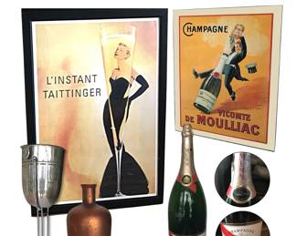Popular bar décor (items not to shown scale): Art Deco-style standing champagne bucket, likely polished steel — seen a few toasts in its day; framed repro 1988-designed advertising poster for House of Taittinger, featuring svelte, glam femme often compared to Grace Kelly or Catherine Deneuve; Marcus Jules’s reproduction of advertising poster for Champagne Vicomte de Moulliac, issued originally by Chambrelent printing house in Paris, c. 1928; sealed Mumm champagne display bottle, 26"H; large decorative copper mercury glass Saint-Emilion/Girdonde display bottle, 19"H (NOTE: Framed Leonetto Cappiello “Parapluie Revel” poster also available.)