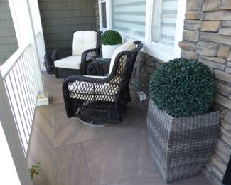 Pair of wicker club chairs with side table, planters