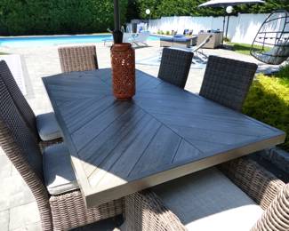 Peter Andrews outdoor dining table with 6 wicker high back chairs & umbrella