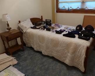 Twin bed, side table, misc. stuff