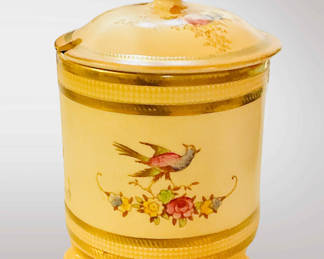 This is a Crown Devon biscuit barrel with bird and floral decoration late 19th early 20th century