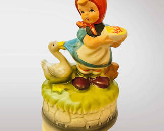 Vintage Hummel-style musical figurine.