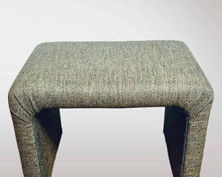 This is a contemporary upholstered ottoman.