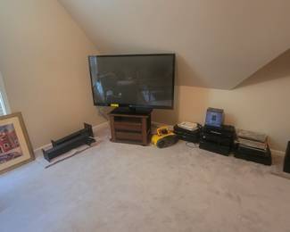 TVs, TV stands, speakers, speaker stands, artwork, stereos, radios, DVD players, DVD/Blu-ray players, disks, CDs, Cameras, camcorders, VHS movies, high school movie players.