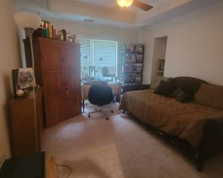 Beautiful bed with a thrundle, new mattresses, desk, chairs, books, bookshelves, cabinets, printers,