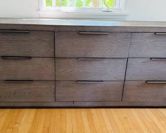 $1,600 - Restoration Hardware Machinto 9-Drawer Dresser - Designed by the Van Thiels, a family-owned company known for their meticulous finish work, our collection mixes bold proportions and clean, mitered lines in a style both rustic and refined. Inspired by 1970s postmodern design, it features American white oak hand finished to highlight its warmth and naturally rich grain.
Overall: 84"W x 22"D x 32"H Side Drawer Interior (6): 24½"W x 14¾"D x 6"H Center Drawer Interior (3): 24¼"W x 14¾"D x 6"H