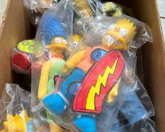 Many collectibles including these Simpson character new in package.