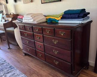 Dresser and lots of linens