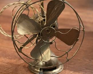 Cool off from these hot deals with this antique brass fan!