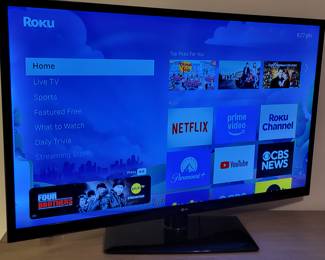 57" LG TV, Roku compatible.