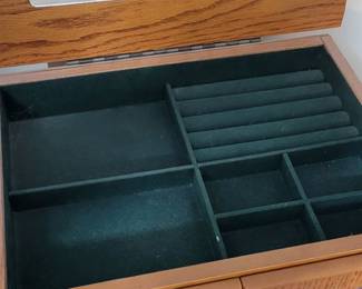 Felt lined top of freestanding jewelry box.
