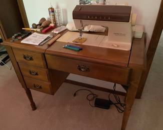 sewing machine in cabinet