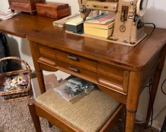 vintage sewing machine in cabinet w/stool