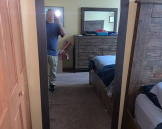 King bed set by Ashley (top of their line) bed, large dresser, mirror, night stand. available for pre sale.