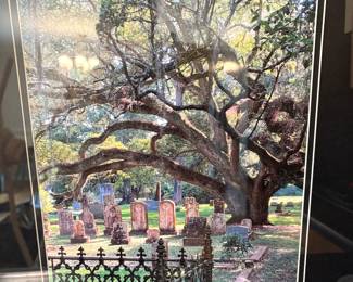 This is a real photograph of a cemetery in Louisiana.  They rode by the cemetery and he saw this perfect shot.  He blew it up and had it framed.  I think it’s great.  