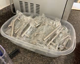 Two sizes of midcentury style kitchen drawer/door handles that the  homeowner never got around to installing.  $2.00 each.  