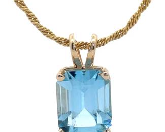 Solitaire Blue Light Topaz Pendant in 14k Yellow Gold