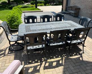 Wrought iron patio table and 8 chairs; includes cushions (see photos of cushions) $1750